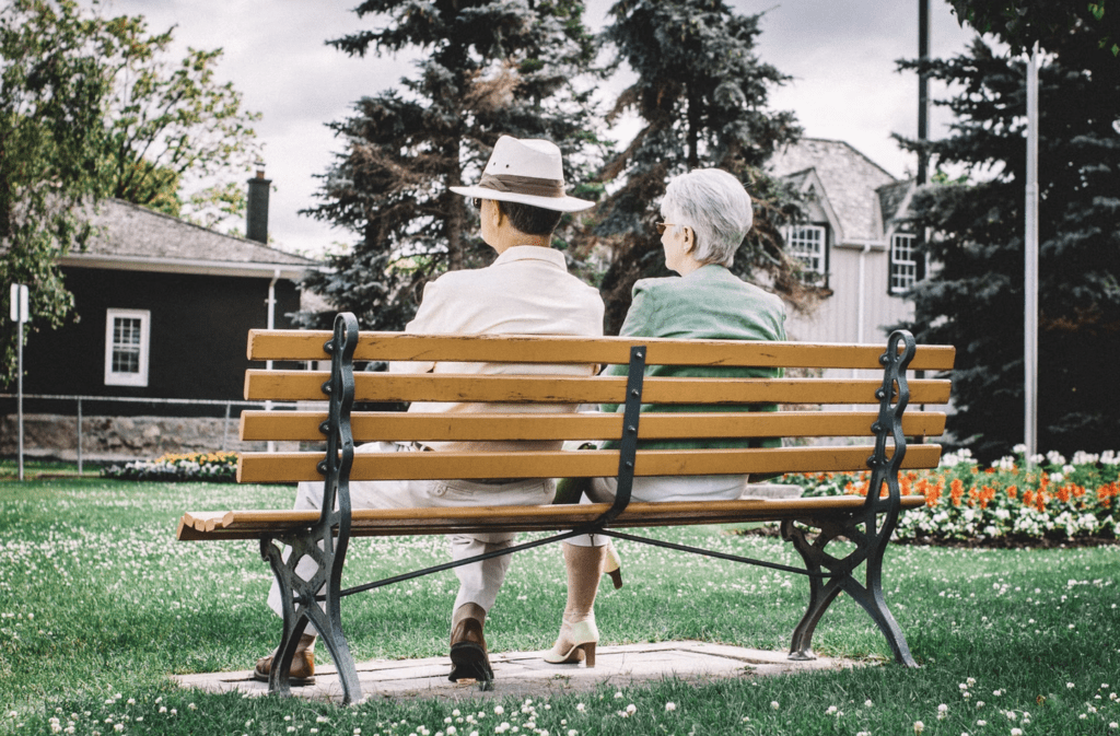 Retired couple sitting on a park bench in Nashville, TN